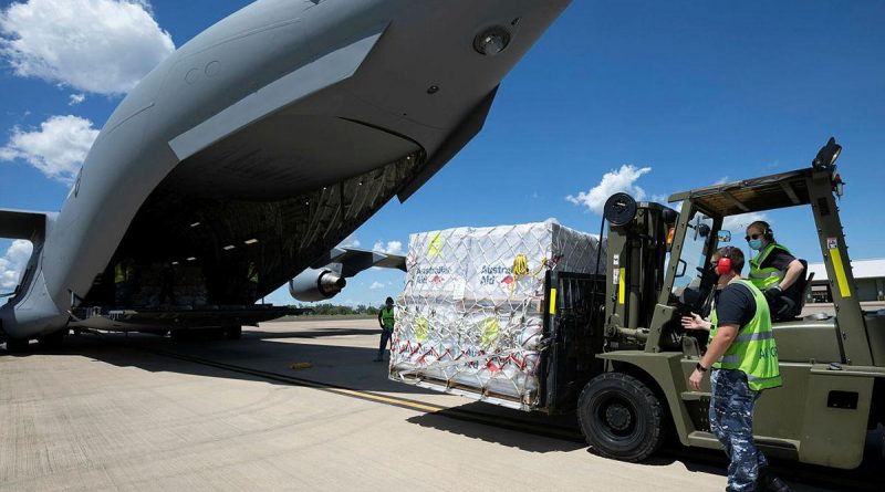Air movements operators from No. 13 Squadron load pallets of humanitarian aid bound for Timor Leste onto a C-17A Globemaster III A41-212 at RAAF Base Darwin. Photo by Petty Officer Peter Thompson.