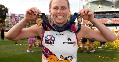 Corporal Kate Lutkins celebrates after winning the best-on-ground award during the 2021 AFLW grand final match. Story by Sergeant Sebastian Beurich. Photo by Michael Willson/AFL Photos.