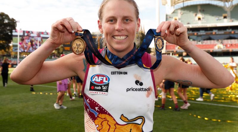 Corporal Kate Lutkins celebrates after winning the best-on-ground award during the 2021 AFLW grand final match. Story by Sergeant Sebastian Beurich. Photo by Michael Willson/AFL Photos.