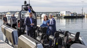 The Whiskey Project executives Ryan Carmichael and Daren Schuback show Minister for Defence Industry Melissa Price their tactical watercraft at Garden Island in Sydney. Photo by Able Seaman Benjamin Ricketts.