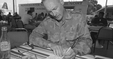 Officer Commanding BASG at Baidoa, Somalia, takes time out to write a postcard home. Photo by Corporal Gary Ramage.