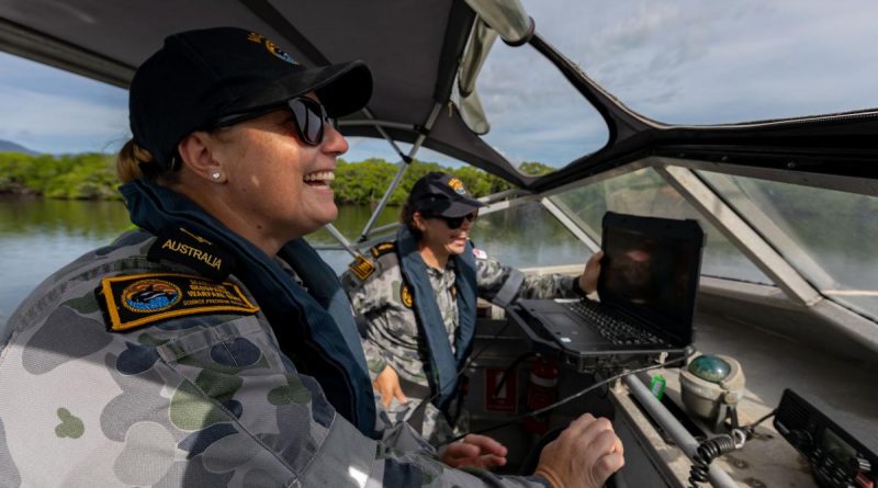 Able Seaman Deneki Stewart, right, and Leading Seaman Tanya Maksimovic conduct surveying operations in Chinaman Creek in Cairns. Story by Sub-Lieutenant Nancy Cotton. Photo by Leading Seaman Shane Cameron.