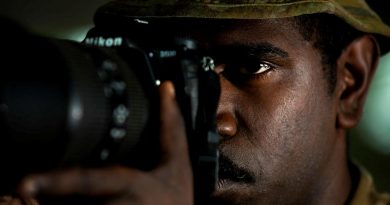 Private Daniel Charlie takes a photo of a watercraft approaching Boigu Island. Story and photo by Sergeant Sebastian Beurich.