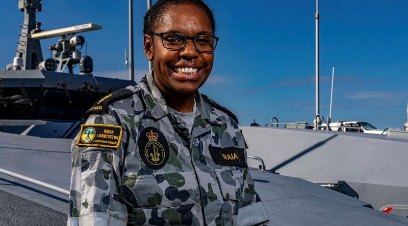 Able Seaman Michaelyn Waia on the forecastle of HMAS Launceston alongside HMAS Coonawarra, Darwin. Story by Sub-Lieutenant Nancy Cotton. Photo by Leading Seaman Shane Cameron.