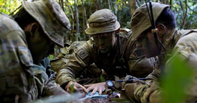 Lieutenant David Adams, centre, from the 6th Battalion, Royal Australian Regiment, briefs Major David Hodge, left, at the Combat Training Centre - Jungle Training Wing, Tully, Queensland. Story by Captain Taylor Lynch. Photo by Corporal Brodie Cross.