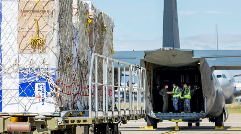 Air Movements Operators from No. 23 Squadron load pallets of AstraZeneca vaccines and COVID-19 medical supplies bound for Fiji onto a C-130J Hercules, at RAAF Base Amberley. Story by Eamon Hamilton. Photo by Leading AIrcraftwoman Emma Scwenke.