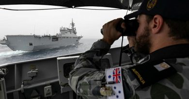 Midshipman Thomas Armstrong checks HMAS Parramatta's distance from Japan Maritime Self-Defense Force vessel JS Ise with laser range-finding binoculars during Exercise ARC21. Story and photo by Leading Seaman Jarrod Mulvihill.