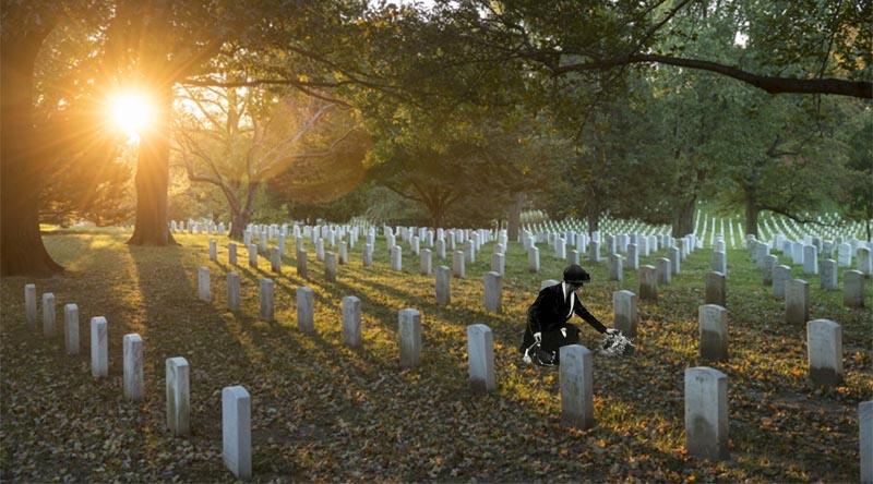 Original photo: Sunrise in Section 35 of Arlington National Cemetery, Arlington, Virginia. US Army photo by Elizabeth Fraser/Arlington National Cemetery. Grieving mother digitally inserted by CONTACT.