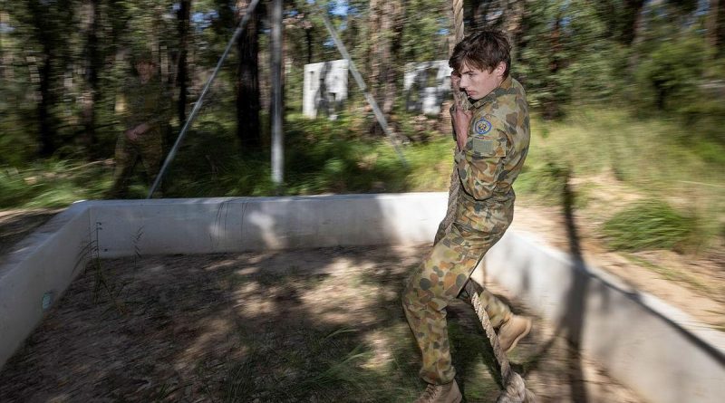 Cadet Warrant Officer Class 2 Hunter Folkes, of Sydney Grammar Army Cadet Unit, swings over the rope pit during the Adventure Training Award at Holsworthy Barracks. Photo by Trooper Jarrod McAneney.