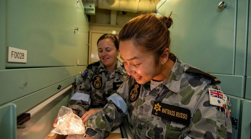 Leading Seaman Tayler Hawkins, left, and Able Seaman Katie Nattrass Russo conduct a stores muster on board HMAS Ballarat during the ship's current regional presence deployment. Story by Lieutenant Gary McHugh. Photo by Leading Seaman Ernesto Sanchez.