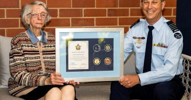 Women’s Auxiliary Australian Air Force veteran Beryl Barton is presented an Air Force 2021 commemorative memento by Senior Australian Defence Force Officer RAAF Base Wagga Group Captain Chris Ellison. Story by Flight Lieutenant Lana Woodhouse. Photo by Sergeant John Marshall.