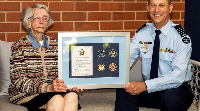 Women’s Auxiliary Australian Air Force veteran Beryl Barton is presented an Air Force 2021 commemorative memento by Senior Australian Defence Force Officer RAAF Base Wagga Group Captain Chris Ellison. Story by Flight Lieutenant Lana Woodhouse. Photo by Sergeant John Marshall.