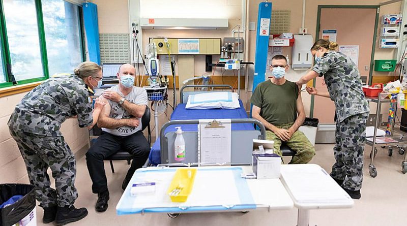 Defence Secretary Greg Moriarty and Chief of the Defence Force General Angus Campbell receive their first dose of the AstraZeneca COVID-19 vaccine at the Duntroon Health Centre, Canberra. Photo by Jay Cronan.