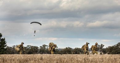 Soldiers from 2 Commando Regiment depart the drop zone after parachuting into crop fields in Temora, NSW. Story by Sergeant Janine Fabre. Photo by Sergeant Janine Fabre.