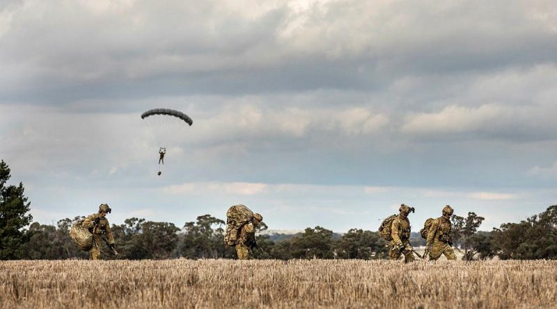 Soldiers from 2 Commando Regiment depart the drop zone after parachuting into crop fields in Temora, NSW. Story by Sergeant Janine Fabre. Photo by Sergeant Janine Fabre.