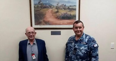 Frank Winnell and Commanding Officer No. 31 Squadron Wing Commander Nick Pausina with the gifted Darcy Doyle print at RAAF Base Wagga. Story by Wing Commander Nick Pausina.