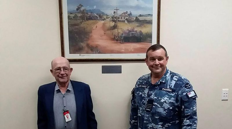 Frank Winnell and Commanding Officer No. 31 Squadron Wing Commander Nick Pausina with the gifted Darcy Doyle print at RAAF Base Wagga. Story by Wing Commander Nick Pausina.