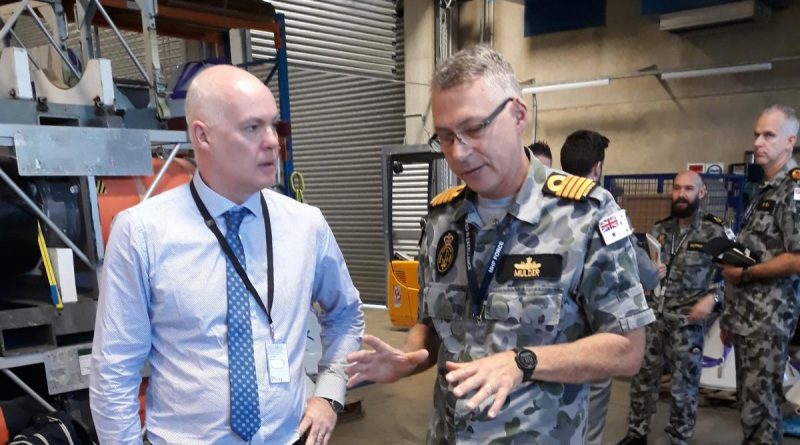 Director of Mission Systems PTY David Battle discusses with Captain Etienne Mulder from the Mine Warfare and Clearance Diving Group about the use of a generator used to jam mine firing systems. Story by Lieutenant Commander Alan Parton.