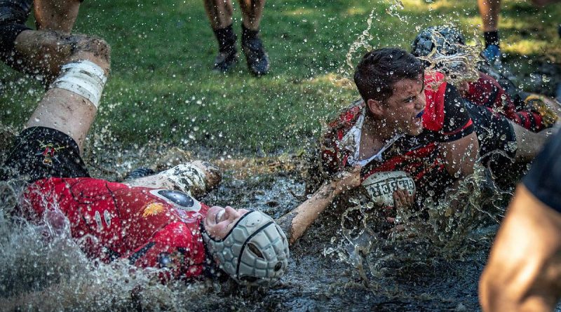 Players from 17 Sustainment Brigade and Combined Arms Training Centre rush to the try line during the Australian Army Inter-Brigade Rugby Competition in Brisbane. Story by Captain Taylor Lynch. Photo by Private Jacob Hilton.