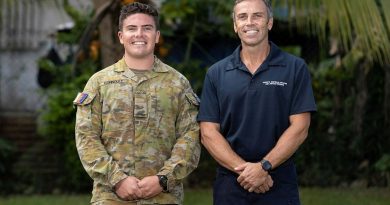 Signaller Jack Connoley with his father, Australian Federal Police Federal Agent John Connoley, at the Vanuatu Police Training College in Port Vila. Story by Corporal Olivia Cameron. Photo by Corporal Olivia Cameron.