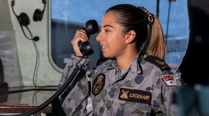 Leading Seaman Lodia Lockhart communicates in Bahasa Indonesia to the Indonesian frigate KRI Diponegoro. Story by Lieutenant Geoff Long. Photo by Leading Seaman Thomas Sawtell.