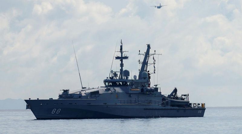 HMAS Maitland off the coast of Honiara, Solomon Islands, and an Air Force C27-J Spartan during a maritime surveillance patrol for illegal fishing activity on Operation Solania. Story by Lieutenant Commander Julia Griffin. Photo by Flight Lieutenant Peter Spearman.