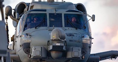 Royal Australian Navy pilots Lieutenant Benjamin Flood and Lieutenant Commander Matthew Schroder at the controls of an 816SQN MH-60R helicopter on HMAS Ballarat. Photo by Leading Seaman Shane Cameron.