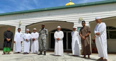 Able Seaman Ebrahim Dollie with members of the Cocos Keeling Islands mosque. Story by Lieutenant Gordon Carr-Gregg. Photo by Lance Corporal Casey Flanagan.