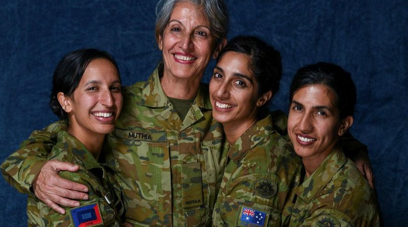 Private Shamila Muthia Azami, second from left, with her daughters Private Seema Muthia, left, Private Uma Muthia, and Private Anissa Muthia at Oakleigh Barracks, Melbourne. Story by Captain Kristen Cleland. Photo by Private Michael Currie.