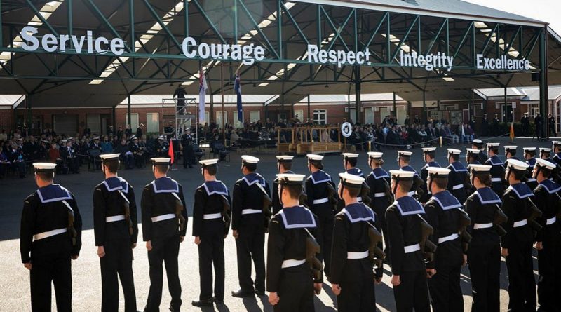 Members of General Entry 388 Emms Division standing at ease during their graduation parade at the Navy Recruit School at HMAS Cerberus, Victoria, with family and friends in the background. Story by Lieutenant Ben Willee. Photo by Leading Seaman Bonny Gassner.