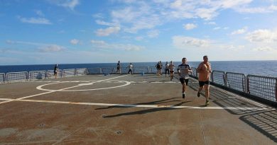 Participants in the HMAS Sirius parkrun event run laps on the ship's flight deck. Story by Lieutenant Geoff Long. Photo by Lieutenant Sarah Lucinsky.