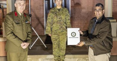 Reservist Private Izzy Kim, centre, with her civilian employer, manager Digital Analytics and Business Enablement at HCF Australia Hari Somayajula receiving a certificate of appreciation from Brigadier Mick Garraway. Story by Alex DeValentin. Photo by Corporal Dan Pinhorn.