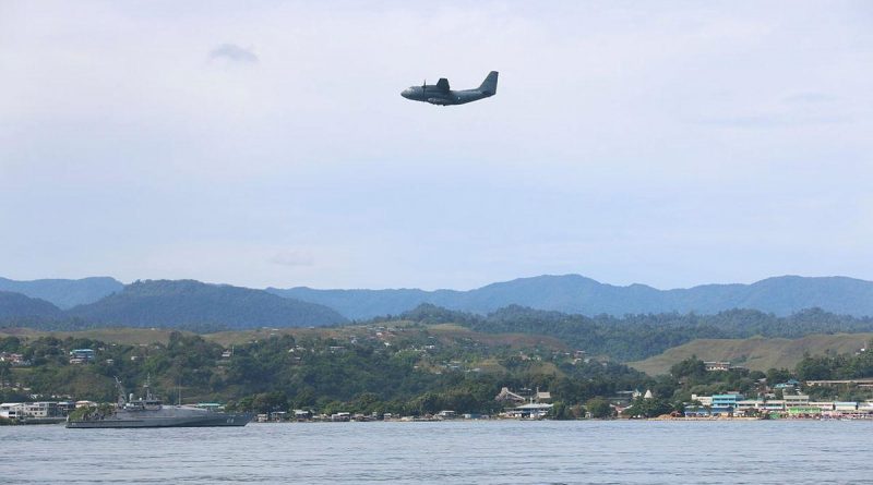 An Air Force C-27J Spartan flies over HMAS Maitland off the coast of Honiara, Solomon Islands, during Operation Solania. Story by Major Anna-Lise Brink. Photo by Seaman Isaiah Appleton.