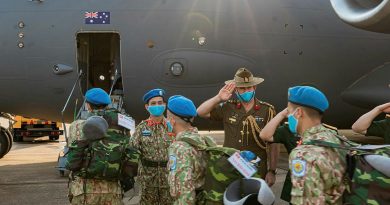 Australian Defence Attache to Vietnam Colonel Paul Foura and senior Vietnamese officers farewell Vietnamese Level Two Field Hospital personnel as they board an Air Force C-17A Globemaster III in Ho Chi Minh City. Photo by Cần Thơ Kỷ Yếu