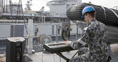 Able Seaman Xavier Riddell plays a tune for HMAS Sirius during a replenishment at sea in the Bay of Bengal. Photo by Leading Seaman Thomas Sawtell.