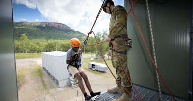 Lance Corporal Jordan Blake assists a participant of the Townsville Fire Youth Engagement Program during resilience activities at Lavarack Barracks. Story by Captain Diana Jennings. Photo by Corporal Brandon Grey.