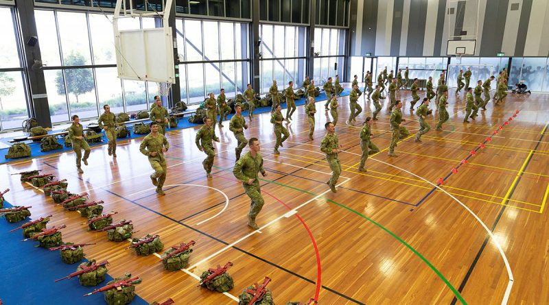 An Australian Army physical training instructor takes candidates through a warm-up before starting the Special Forces Entry Test at Holsworthy Barracks, Sydney, on Monday, 01 March 2021. Story by Lieutenant Anthony Martin. Photo by Leading Aircraftwomwan Jacquelline Forrester.