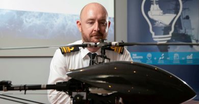 Lieutenant Commander Bryan Cromie from the Robotic Autonomous Systems and Artificial Intelligence Team, Warfare Innovation Navy Branch, with a remotely piloted aircraft at the virtual Autonomous Warrior event in Canberra, ACT. Photo by Petty Officer Bradley Darvill.