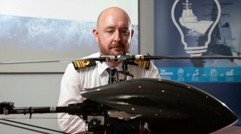 Lieutenant Commander Bryan Cromie from the Robotic Autonomous Systems and Artificial Intelligence Team, Warfare Innovation Navy Branch, with a remotely piloted aircraft at the virtual Autonomous Warrior event in Canberra, ACT. Photo by Petty Officer Bradley Darvill.