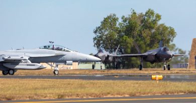 An Air Force EA-18G Growler, aircraft taxis past two F-35A Lightning II aircraft on its way to the runway, during exercise Arnhem Thunder held at RAAF Base Darwin, Northern Territory. Photo by Leading Aircraftman Stewart Gould.