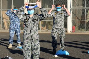 Seaman Haley Coleman and other Australian Defence Force members practice correct application of Personal Protective Equipment (PPE). Captain Kristen Daisy Cleland.