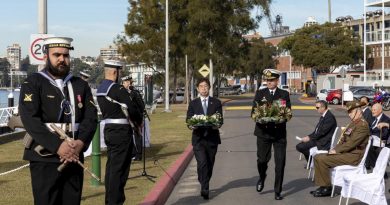 Commander Australian Fleet Rear Admiral Mark Hammond and Consul-General of Japan Kiya Masahiko prepare to lay wreaths during the memorial service at HMAS Kuttabul. Story by Lieutenant Brendan Trembath. Photo by LSIS Leo Baumgartner.