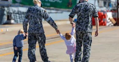 (L-R) Lieutenant Brittany Craig and HMAS Anzac Flight Commander, Lieutenant Commander Timothy Craig with their children (from left) Hunter and Harper at Oxley Wharf at Fleet Base West, Western Australia. Story by Harriet Pointon Mather. Photo by Leading Seaman Ronnie Baltoft.