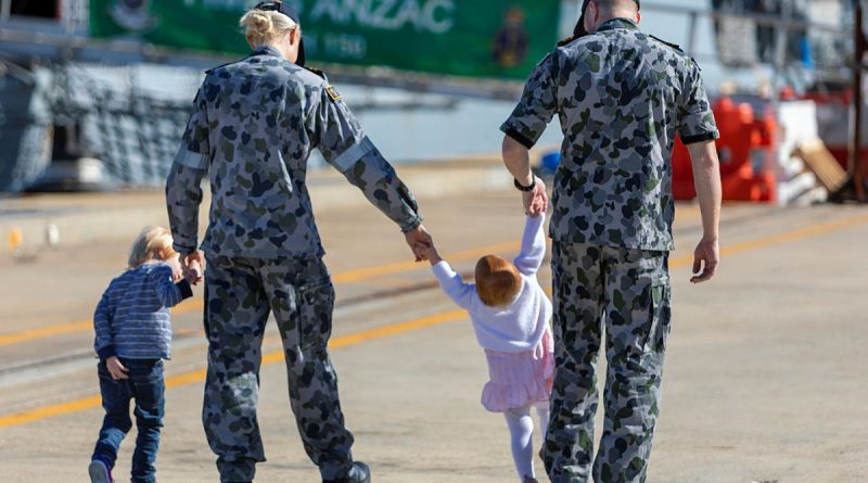 (L-R) Lieutenant Brittany Craig and HMAS Anzac Flight Commander, Lieutenant Commander Timothy Craig with their children (from left) Hunter and Harper at Oxley Wharf at Fleet Base West, Western Australia. Story by Harriet Pointon Mather. Photo by Leading Seaman Ronnie Baltoft.