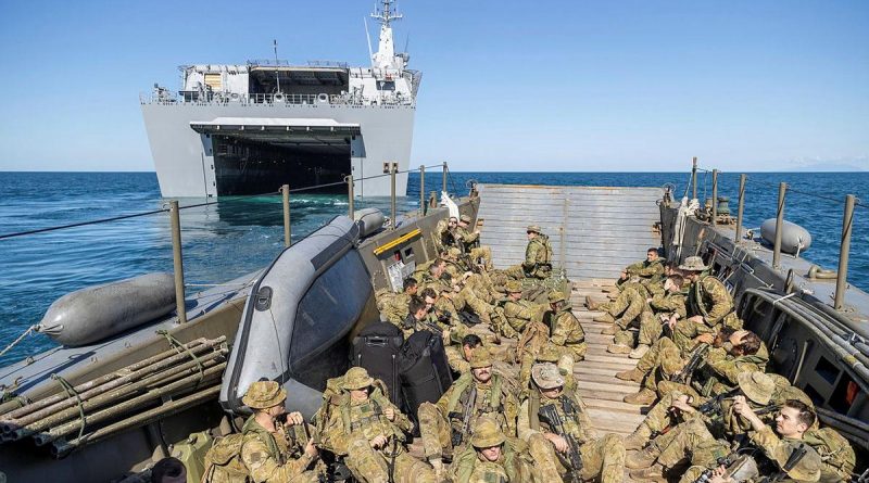 Soldiers from the 2nd Battalion, Royal Australian Regiment, on board an Australian Army LCM-8 landing craft depart HMAS Canberra for beach landing serials during Exercise Sea Explorer. Story by Captain Dan Mazurek. Photo by Leading Aircraftwoman Jacqueline Forrester.