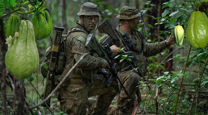 Australian Army Private Sam Randall and Corporal James Milne from the 8th/9th Battalion, Royal Australian Regiment on Exercise Wolf Crawl, at the Canungra Field Training Area, Queensland. Base photo by Private Jacob Hilton. Digitally added to by CONTACT.