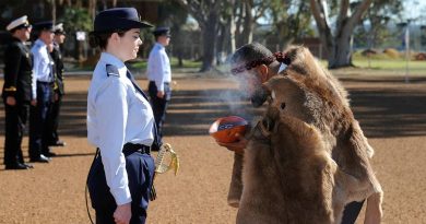 Pilot Officer Christina Way participates in a traditional smoking ceremony conducted by Whadjuk Elder Barry Winmar during the No. 261 Advanced Pilot Course Graduation at RAAF Base Pearce, WA. Story by Flight Lieutenant Julia Ravell. Photo by Chris Kershaw.