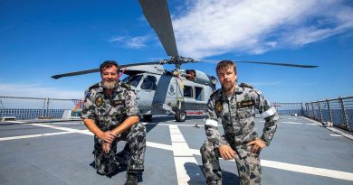 Petty Officers Andrew Booth, left, and Patrick Williams, from 816 Squadron's Flight 3 crew, with HMAS Ballarat's embarked MH-60R. Story by Lieutenant Gary McHugh. Photo by Leading Seaman Ernesto Sanchez.