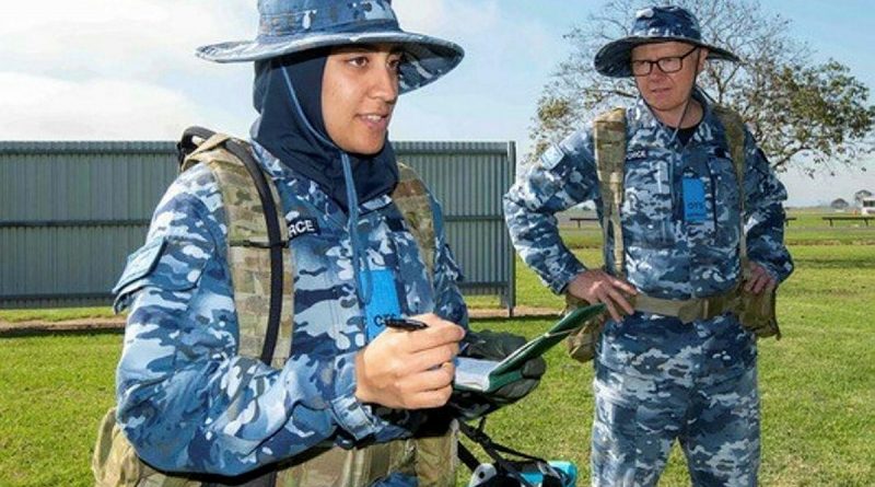 Flying Officer Ayah Khalid, left, with Leadership Reaction Course team member Flying Officer Clayton Wilson during a course at Officer Training School at RAAF Base East Sale. Story by Flight Lieutenant Julia Ravell. Photo by Flight Sergeant Scott Robbins.