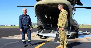 Former Army technician Greg Maiden, left, is congratulated by Commanding Officer 5th Aviation Regiment Lieutenant Colonel Christopher McDougall after completing 5000 flying hours in the CH-47. Story by Captain Carolyn Barnett. Photo by Private Emily Mann.